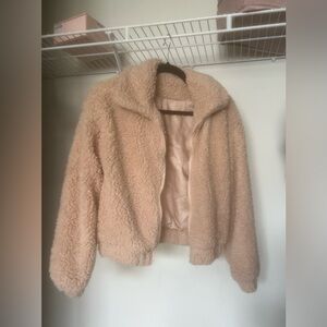 Fluffy beige jacket with a satin lining